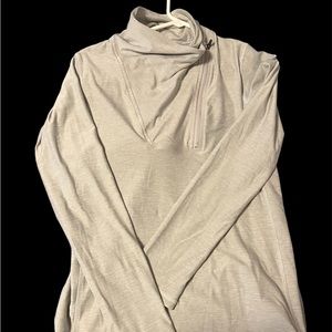 New Balance medium gray pull over. Cute neck with zipper.